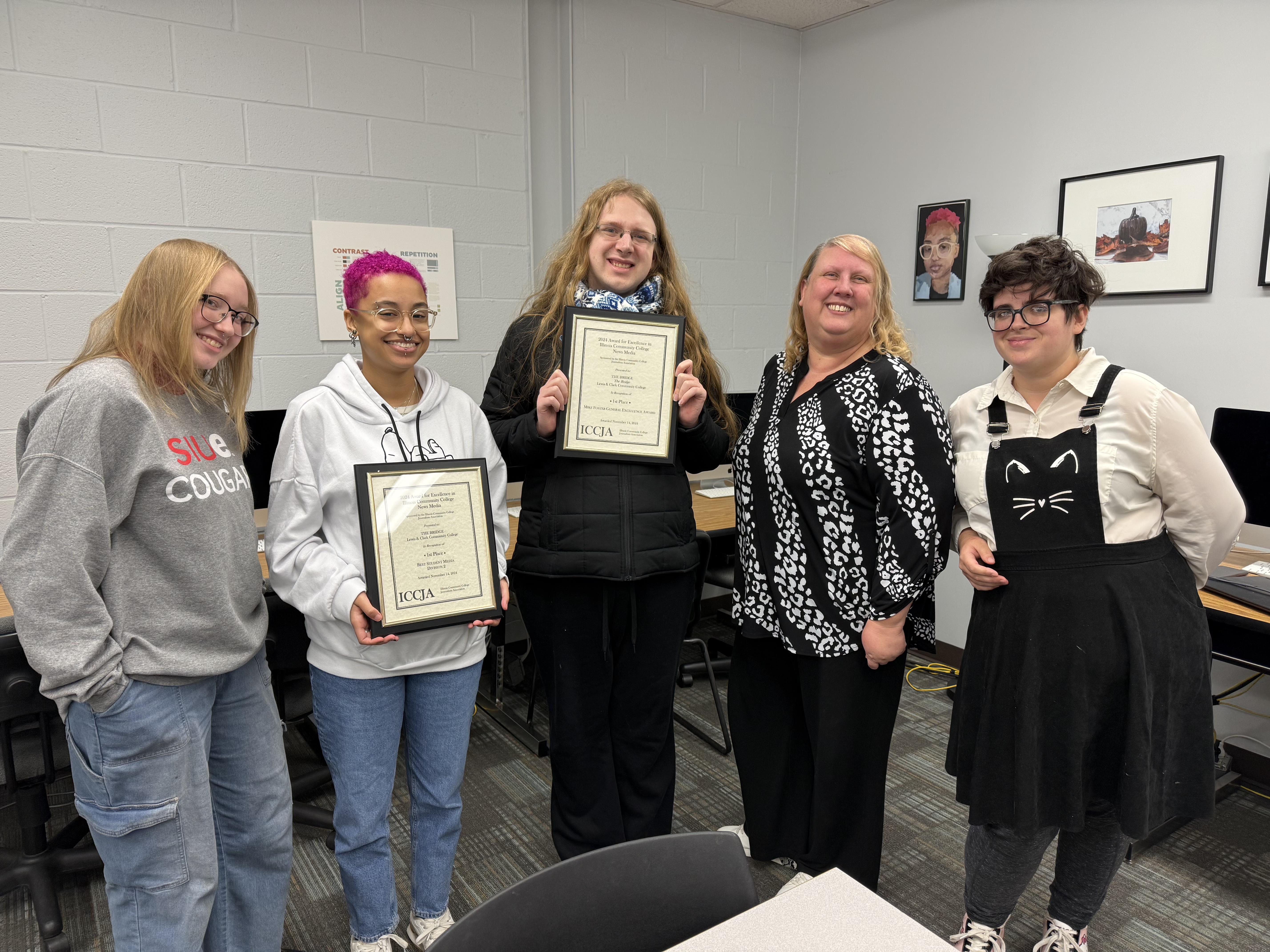 Pictured from left to right, Katie Loethen, Kal Weiss, Violet Mayes, Jeannette Carrington and Taylor Smith celebrate the staff’s accomplishments during their 2024 holiday party/final meeting of the year.