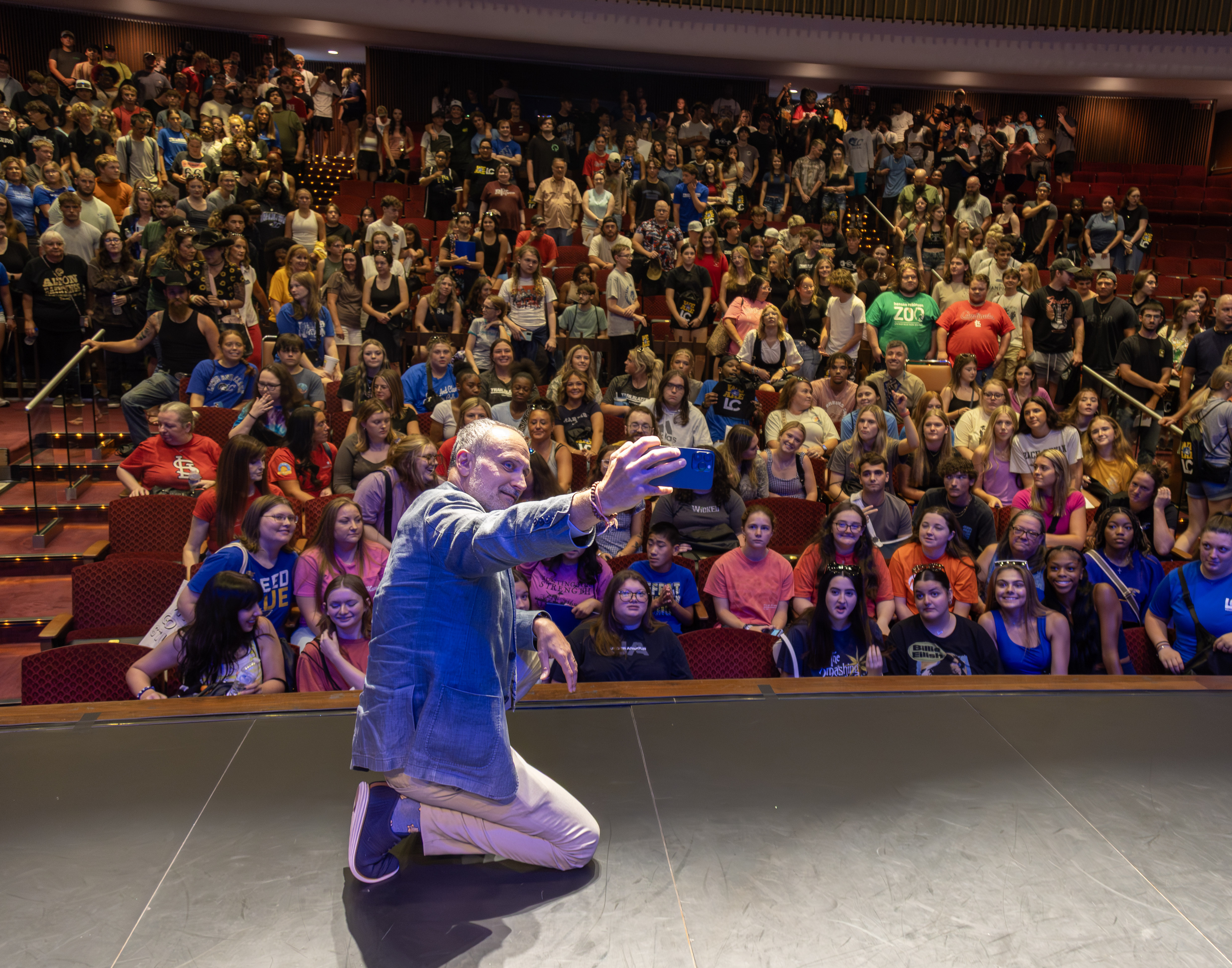 Lewis and Clark President Ken Trzaska stops to take a selfie with the students and family members in the crowd, Wednesday, during Trailblazer Welcome Day. JAN DONA/LC Marketing & PR