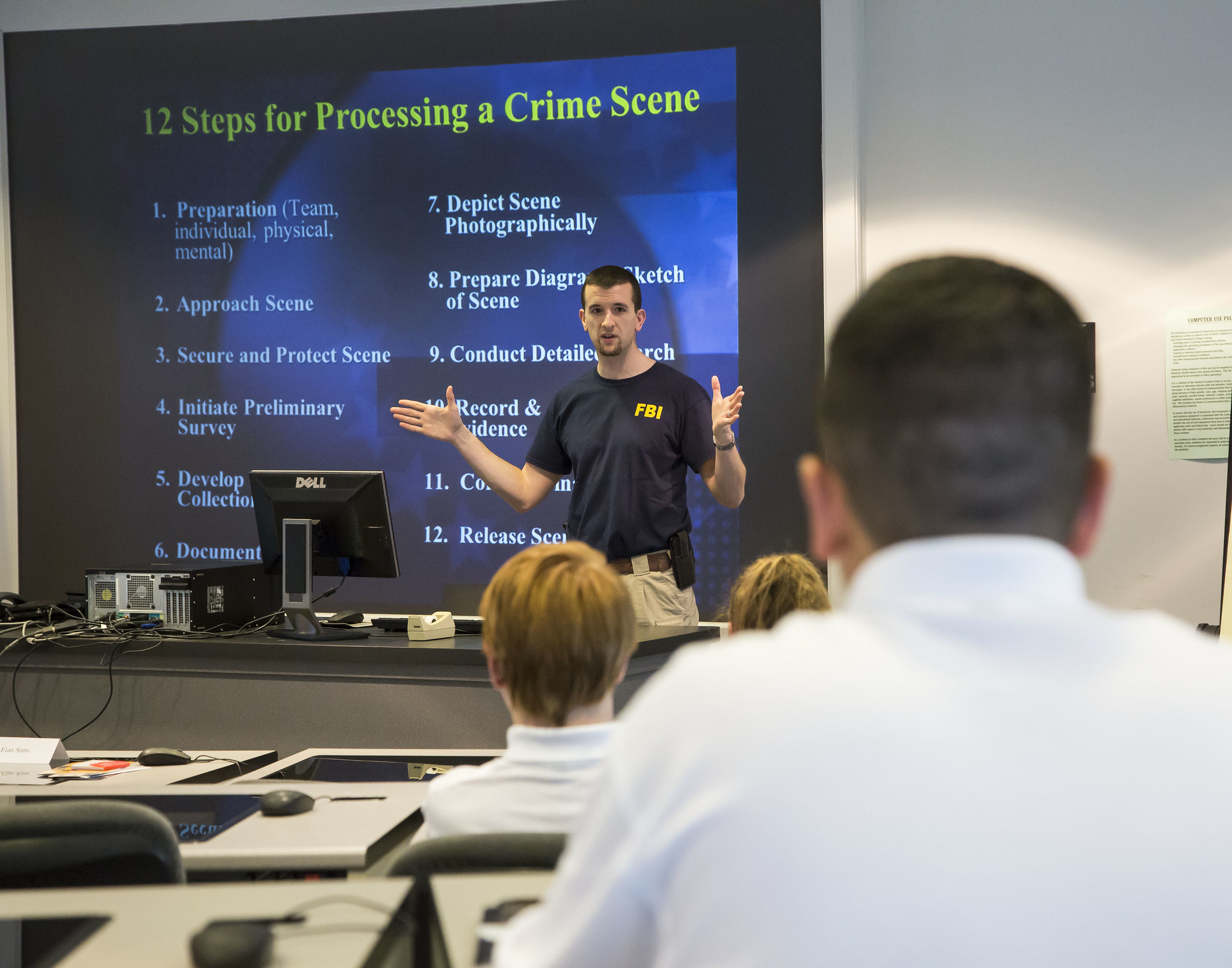 Students learn about crime scene management from a member of the FBI. JAN DONA/L&C MARKETING & PR