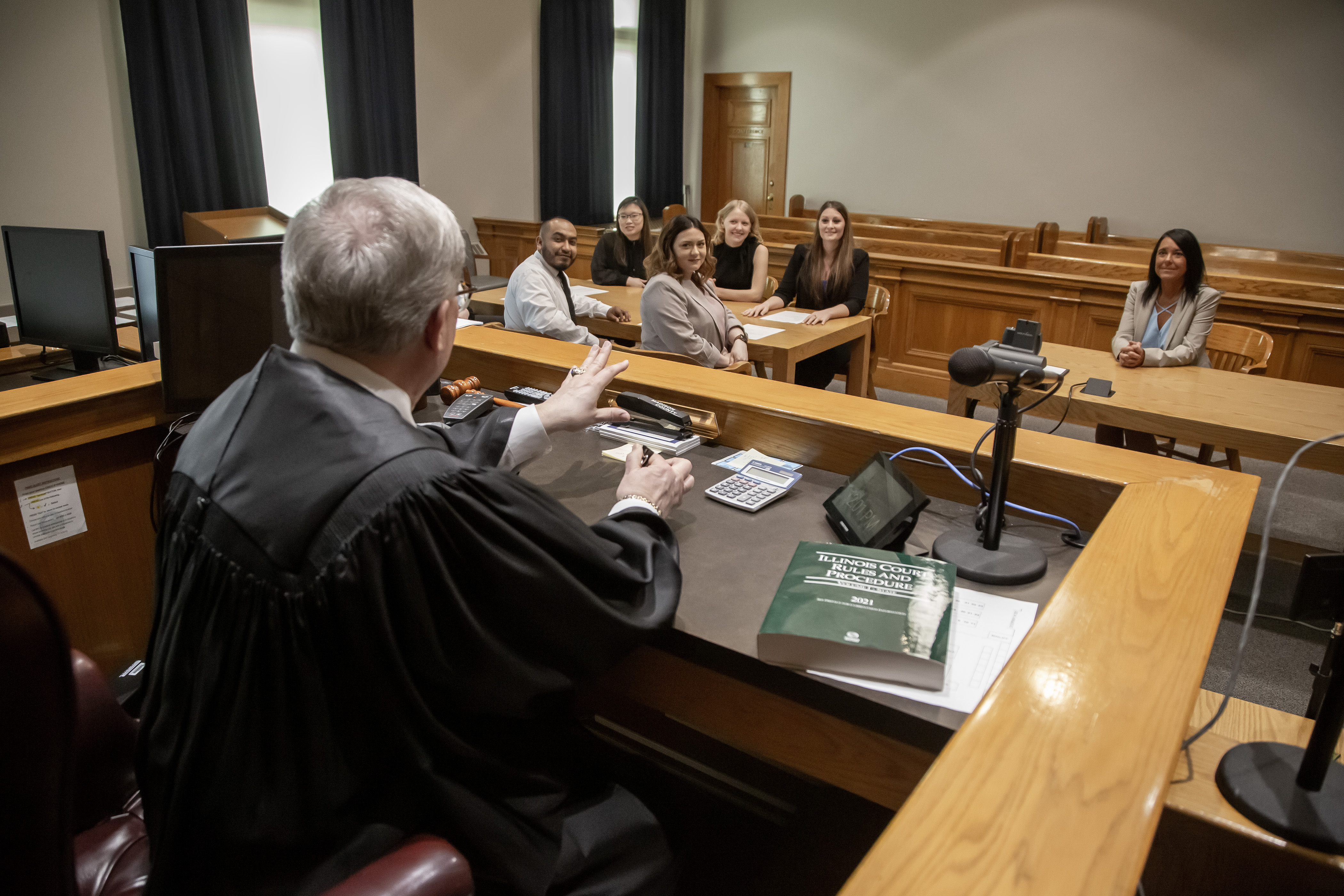Circuit Judge Dennis Ruth meets with a group of L&C paralegal students in his Madison County courtroom. JAN DONA/L&C MARKETING & PR