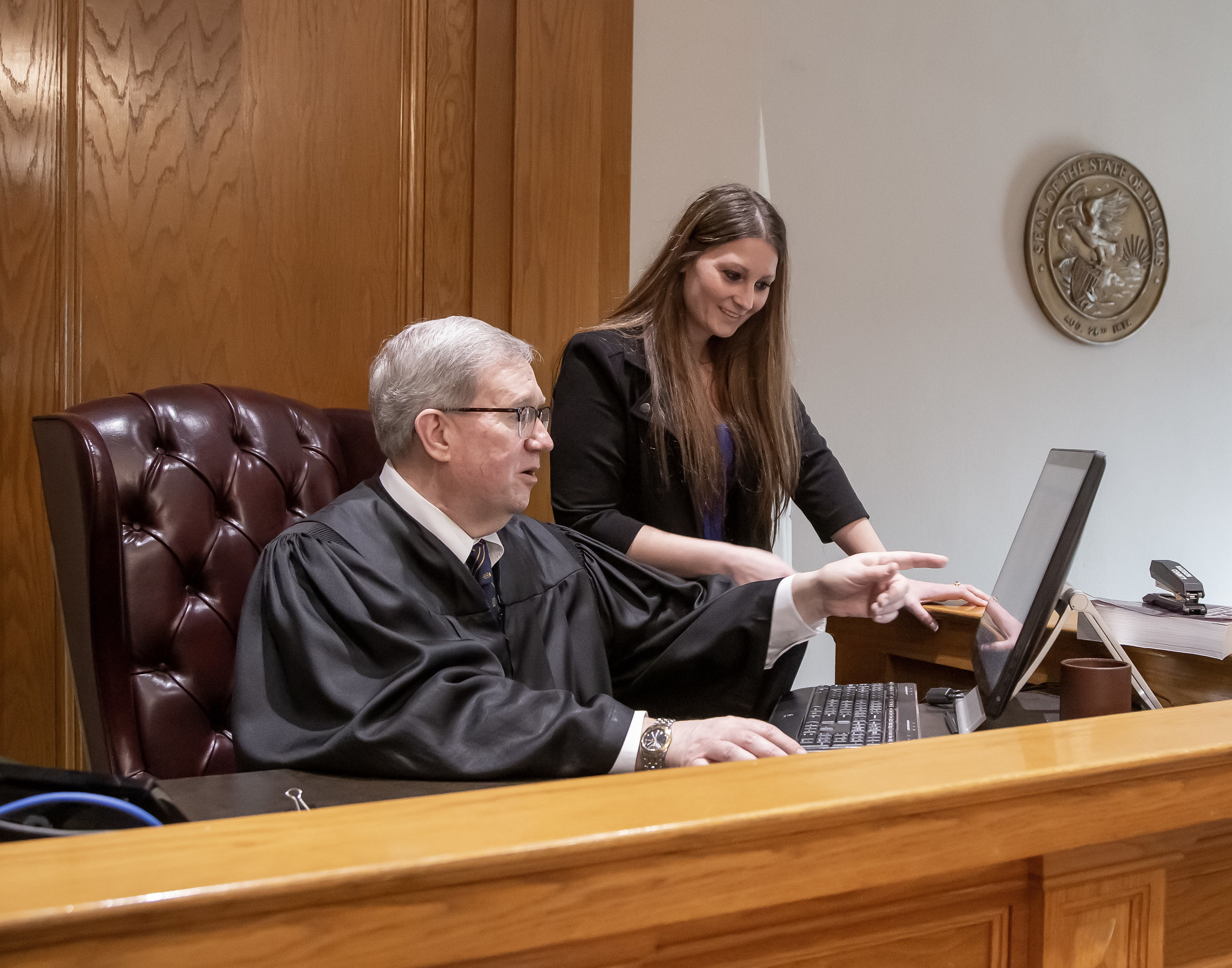 Circuit Judge Dennis Ruth meets with a group of L&C paralegal students in his Madison County courtroom. JAN DONA/L&C MARKETING & PR