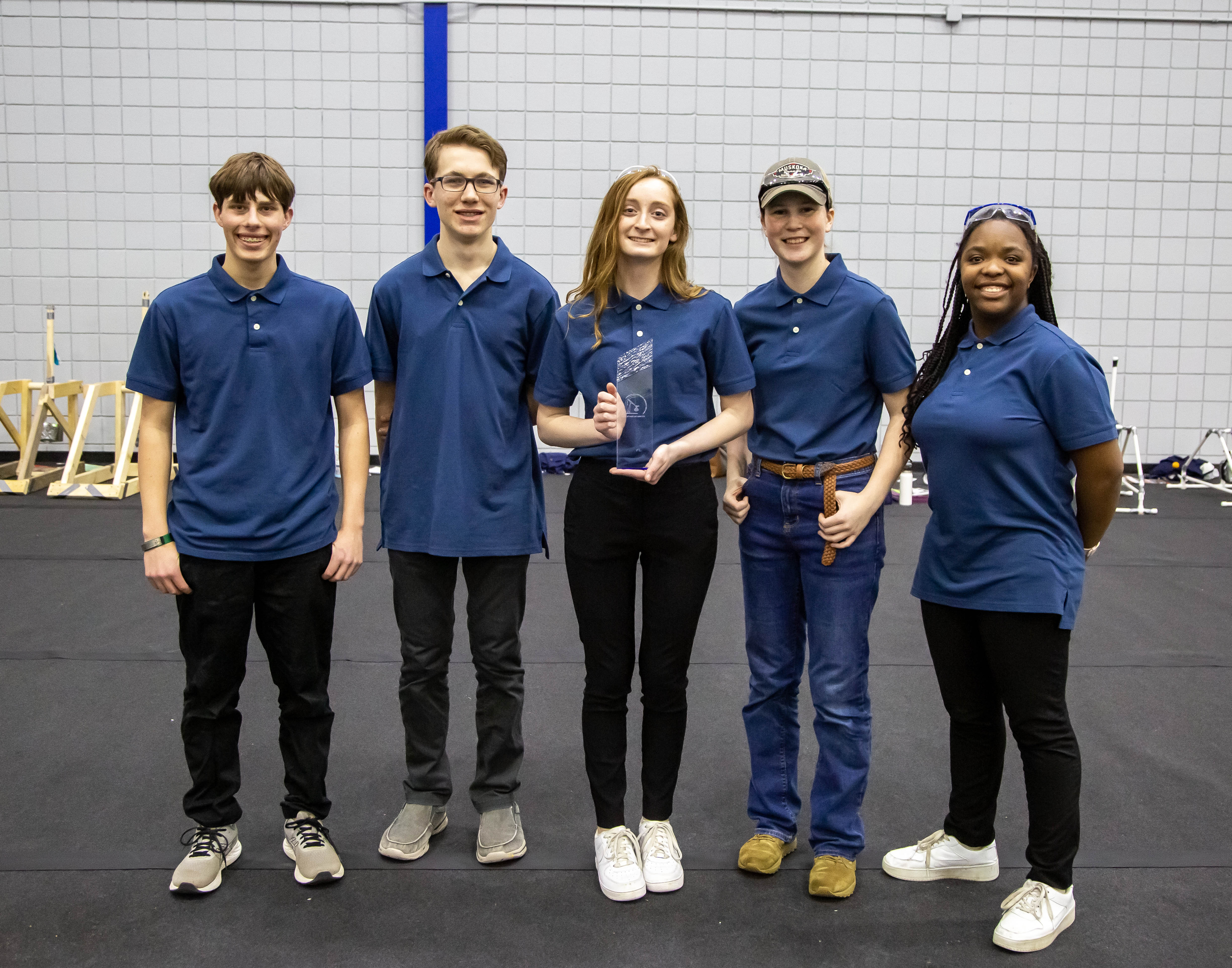 M3, a team of area homeschool students, took first place in the journaling contest and second place in trebuchet. Pictured, from left to right, are Jacob Schaper, Blake Schaper, Caroline Bleymaier, Abi Zimmerman and Sophia Bleymaier