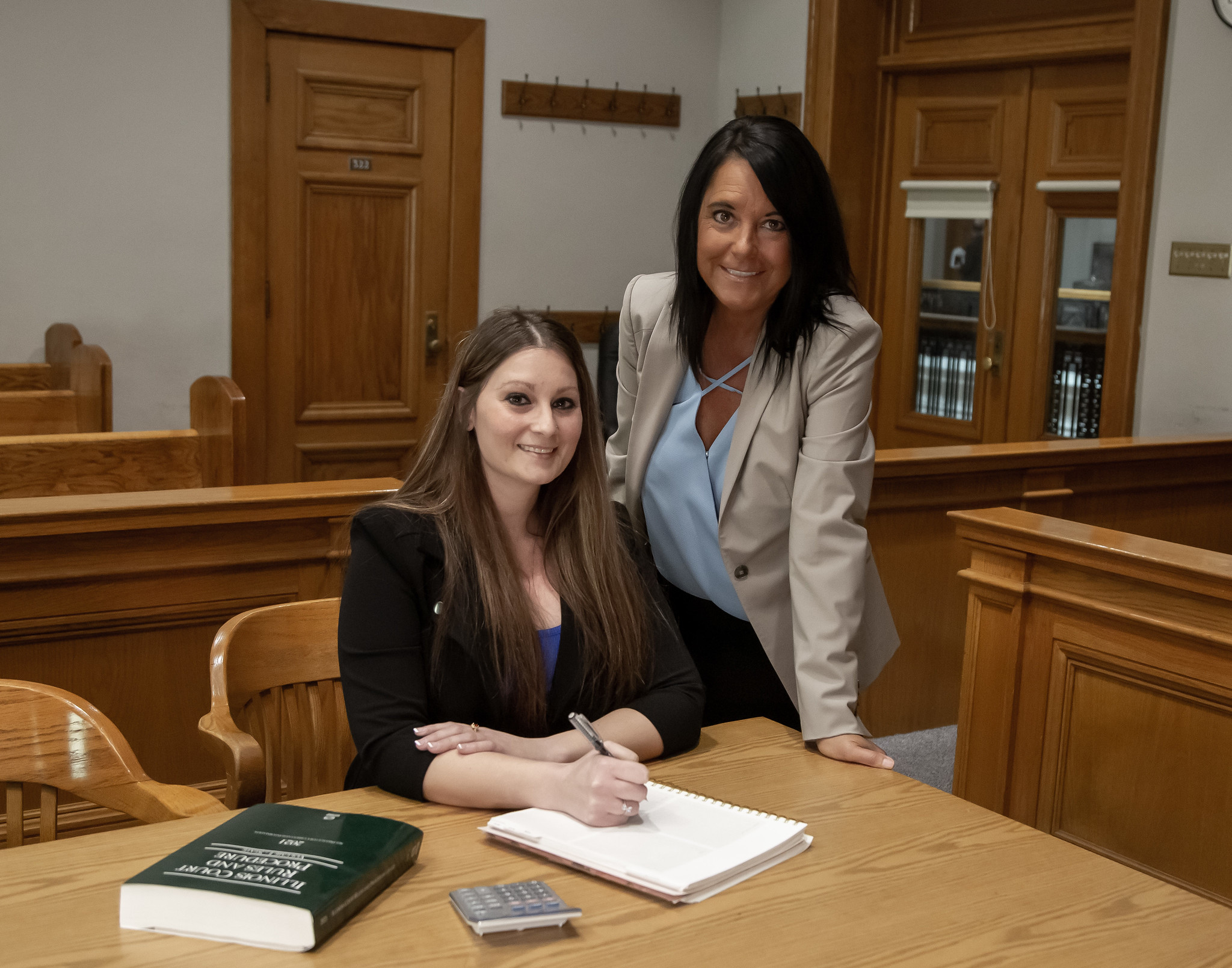 L&C Paralegal Program Coordinator Becky Gockel and students, Audrey Gorline and Gabriel Calixto, meet in a Madison County courtroom. Jan Dona, L&C Marketing & PR.