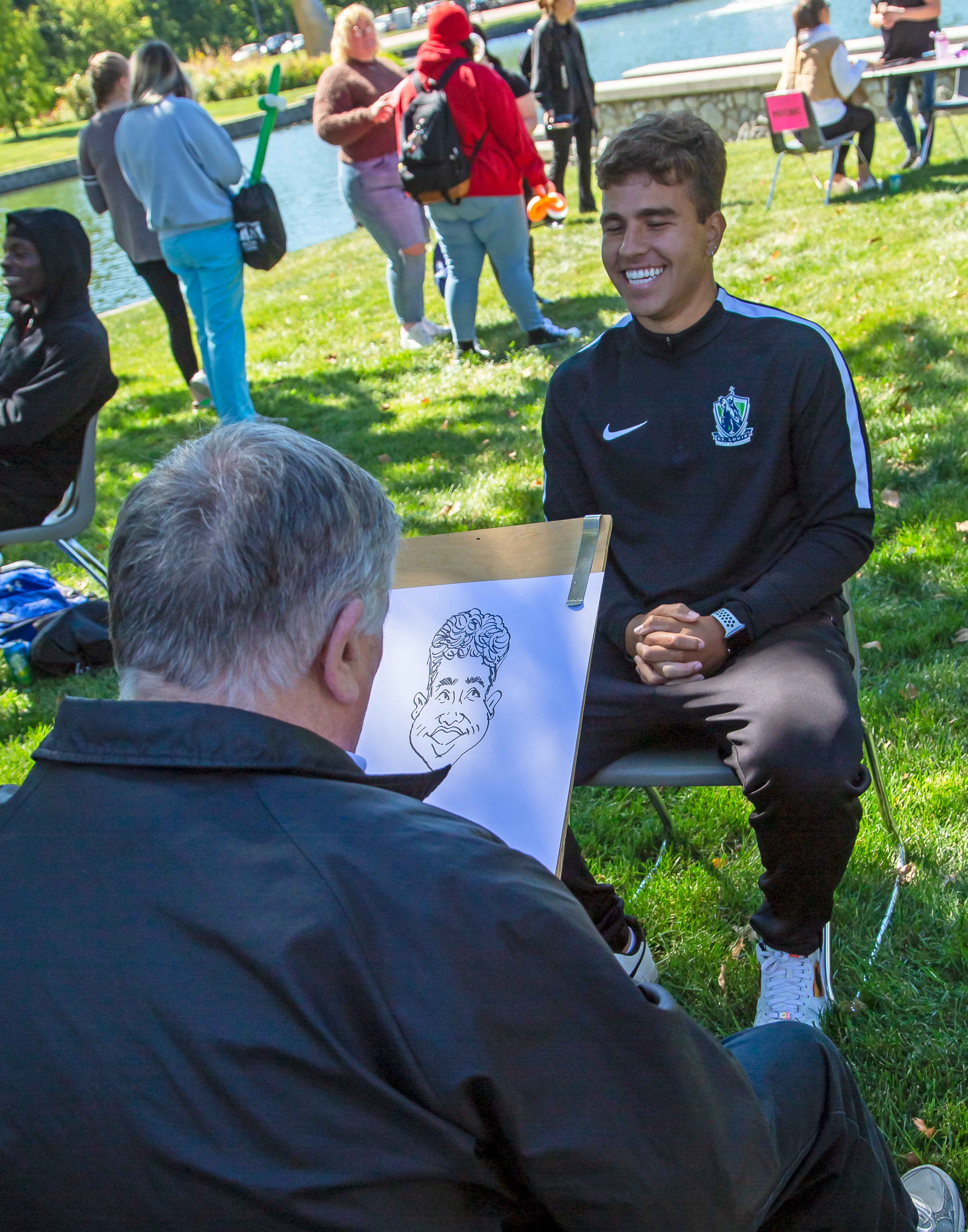Trailblazers soccer player Eduardo Rodrigues sits for a caricaturist during Fall Fest 2022 on L&C’s Godfrey Campus. While Fall Fest is for L&C students, Summerfest will offer a similar experience for the entire community from 4-6 p.m., Thursday, July 13. JAN DONA/L&C Marketing & PR