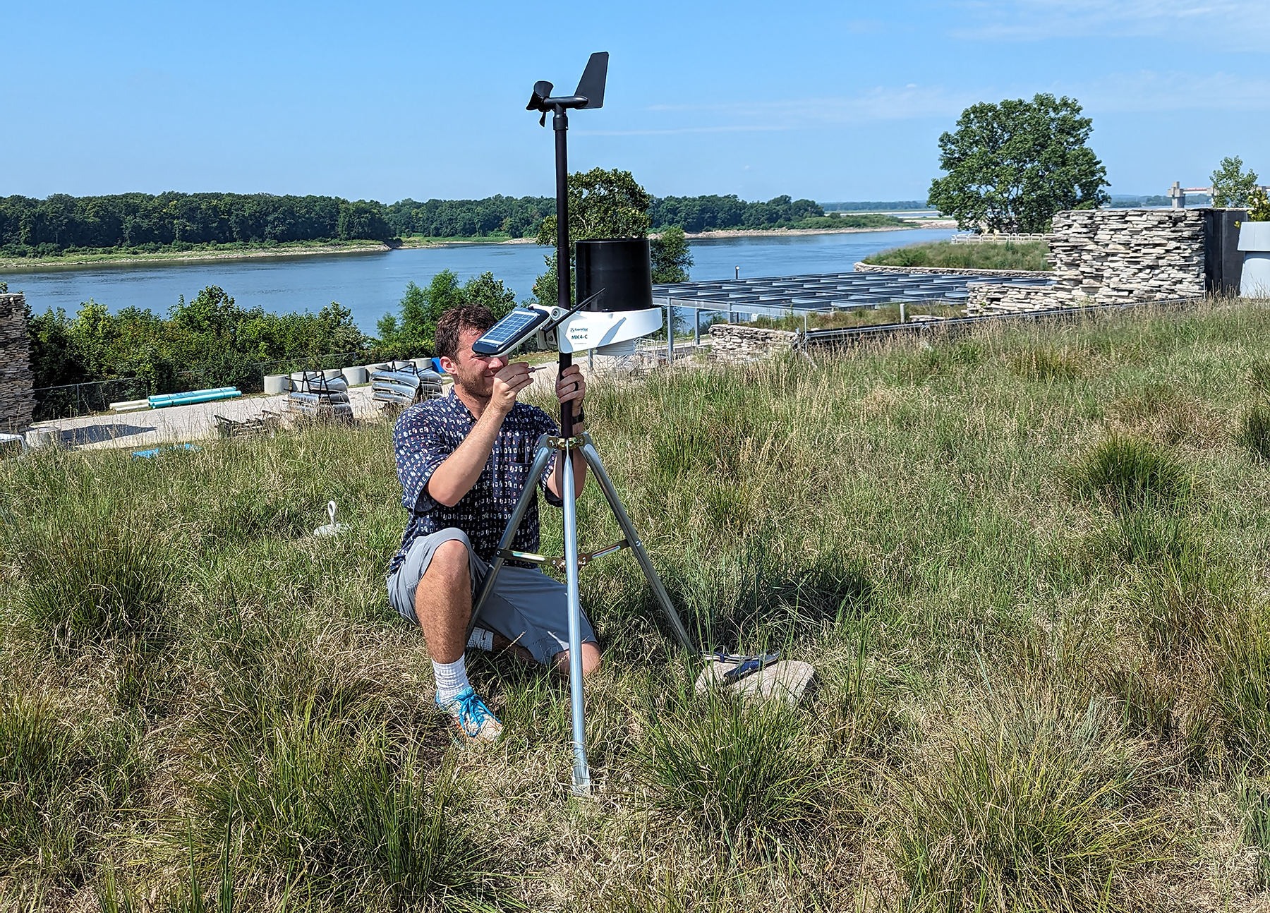 Doctoral student Ryan Kelly sets up the Mesonet station on the roof of NGRREC’s Field Station in East Alton.