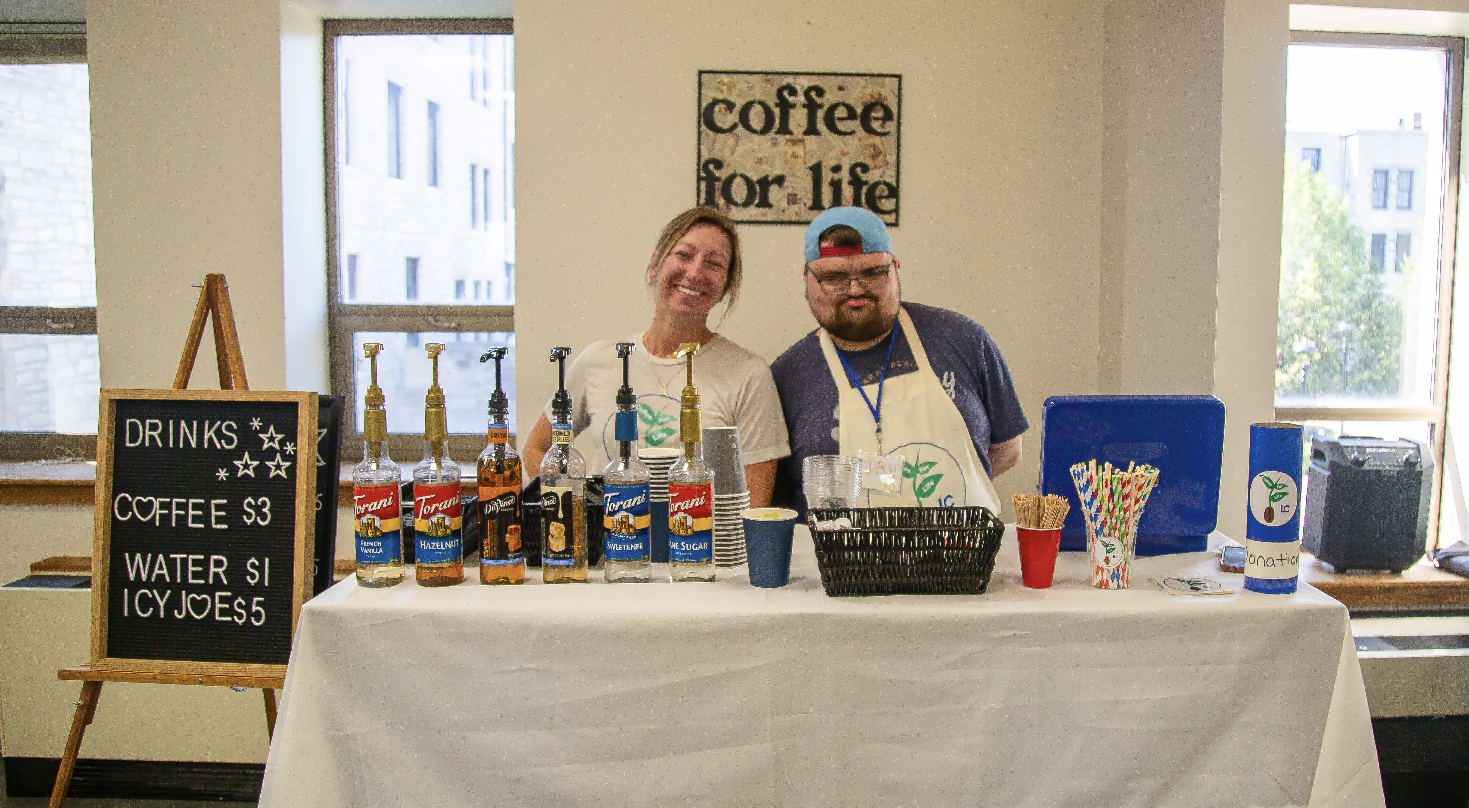 CFL Instructor Katelyn Baahlmann and CFL student Jay LaPlant at the Coffee for Life stand. JARED SMILACK/L&C Marketing & PR