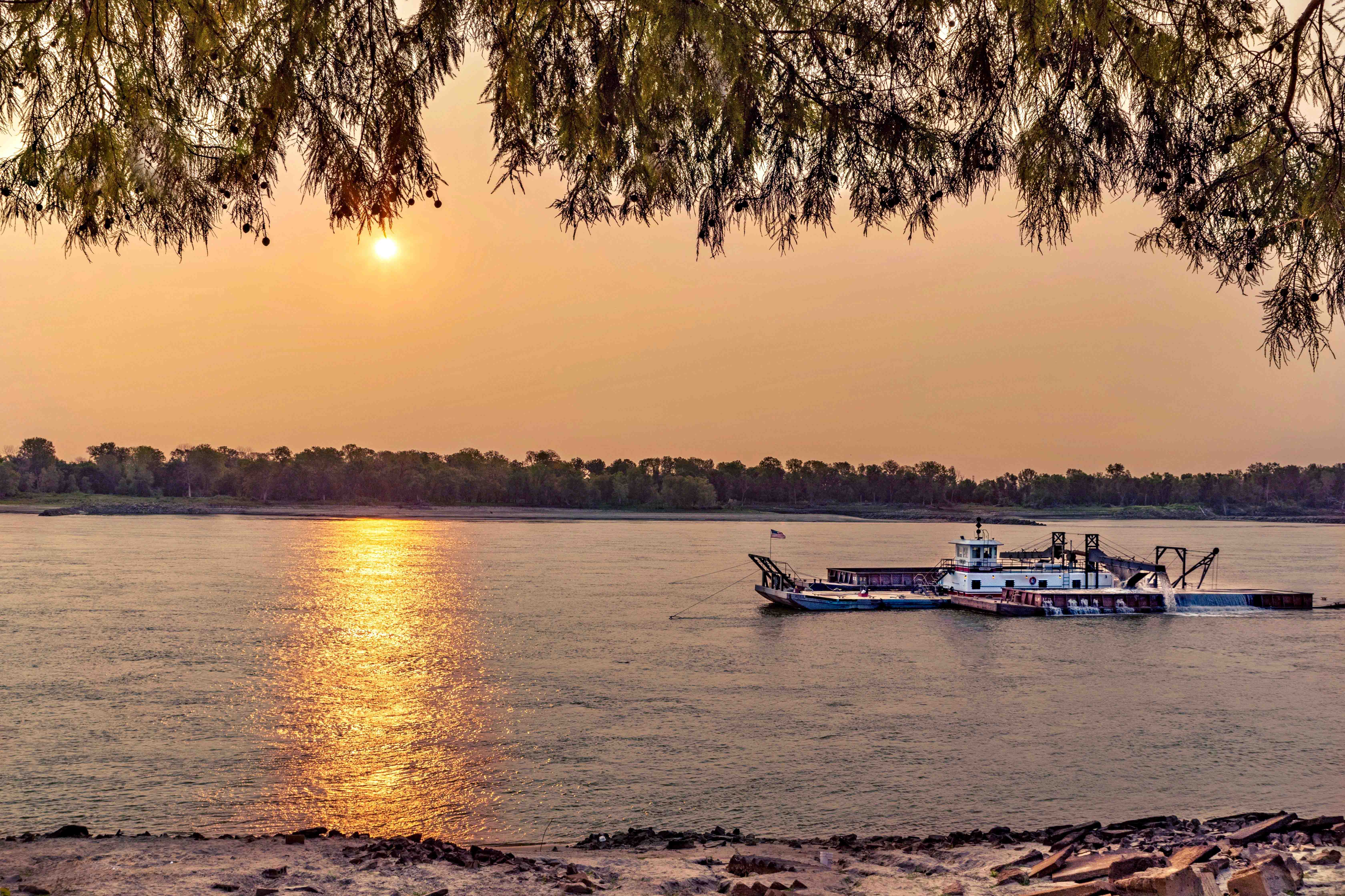 The sun shines over the Mississippi River. Photo by Mary Pisoni