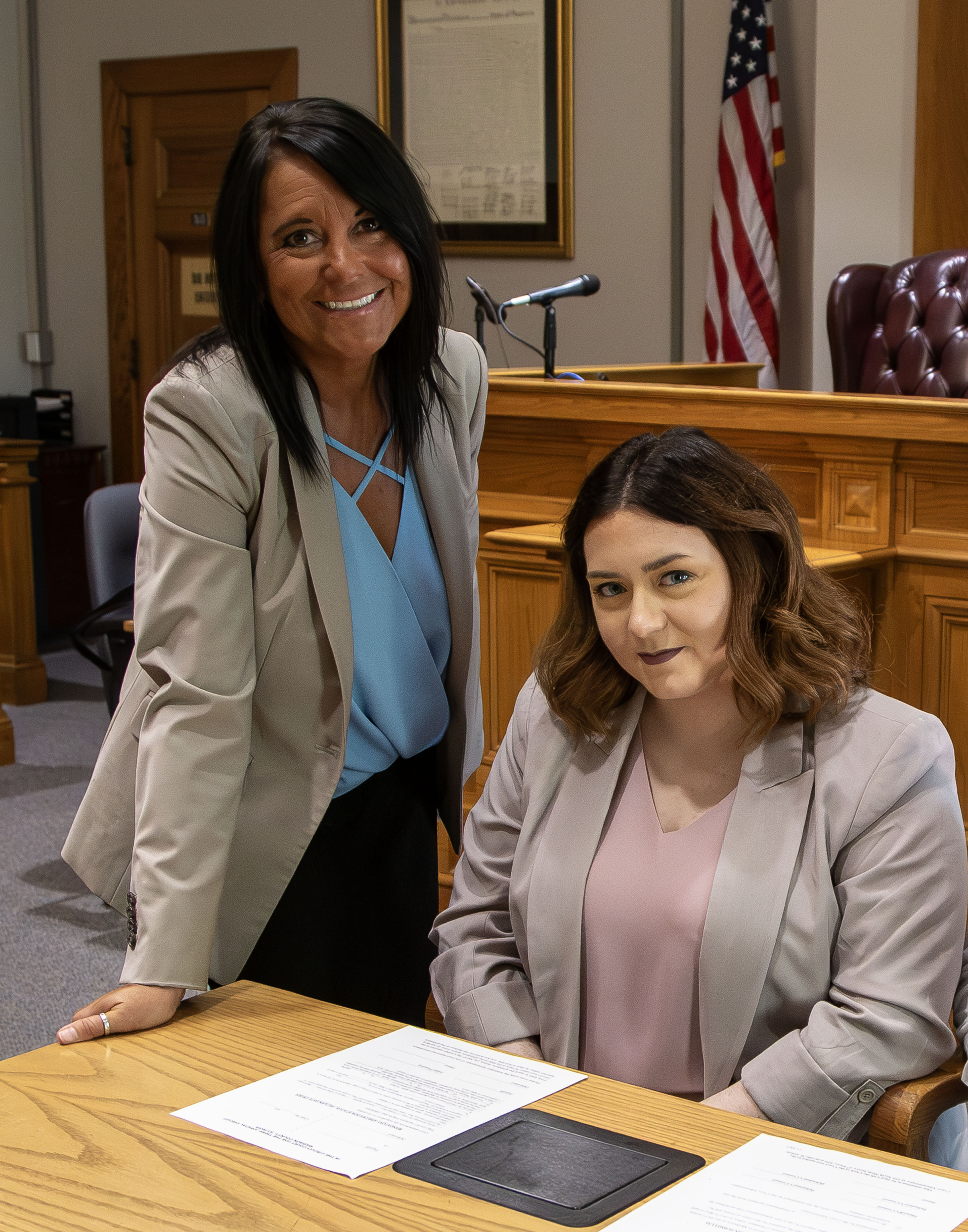 Paralegal Studies Program Coordinator Becky Gockel (left) and student Audrey Haas review notes at the Madison County Courthouse. 