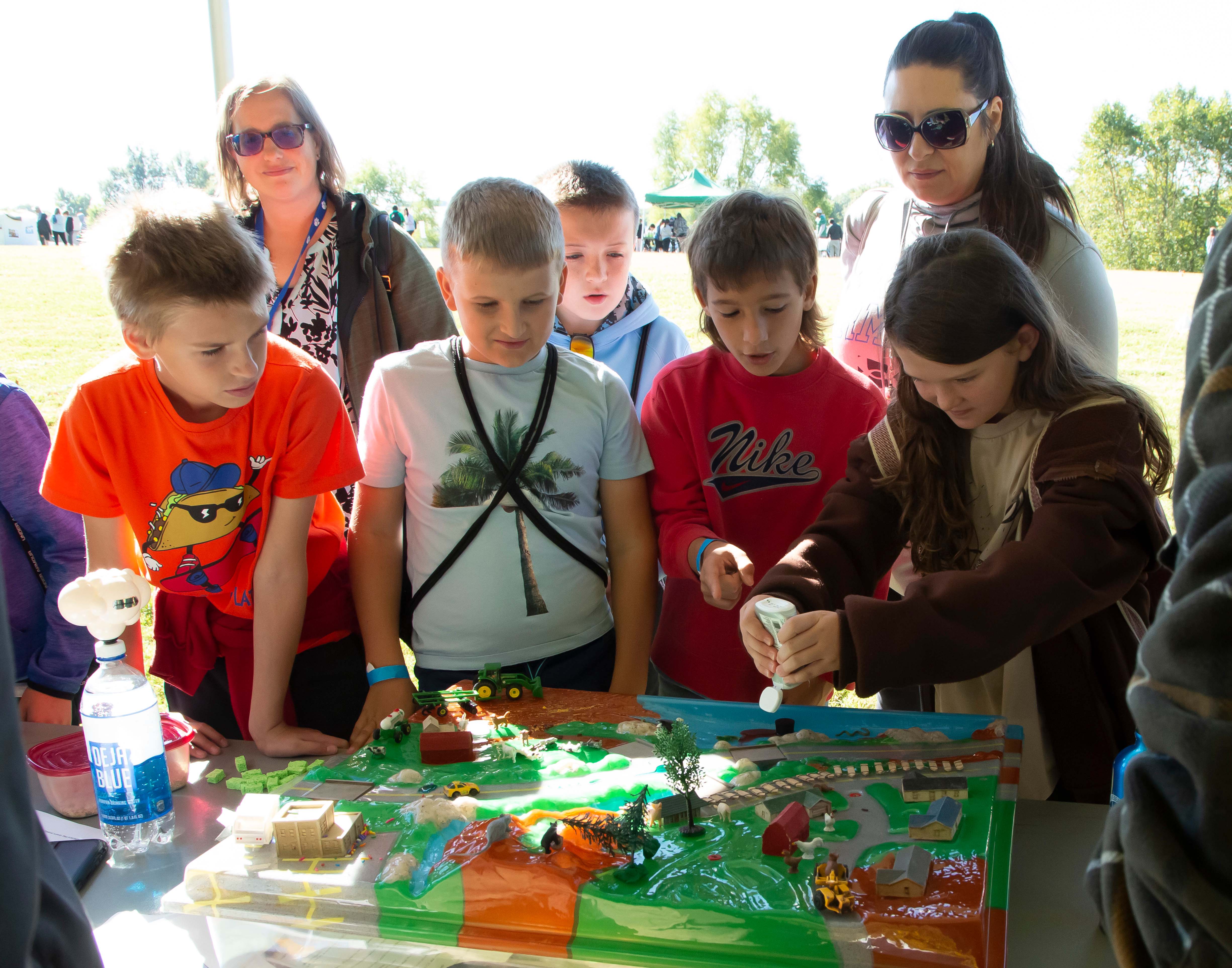 Fifth grade students working with the Enviroscape watershed model at last year’s Water Festival. Photo by JAN DONA/L&C MARKETING & PR