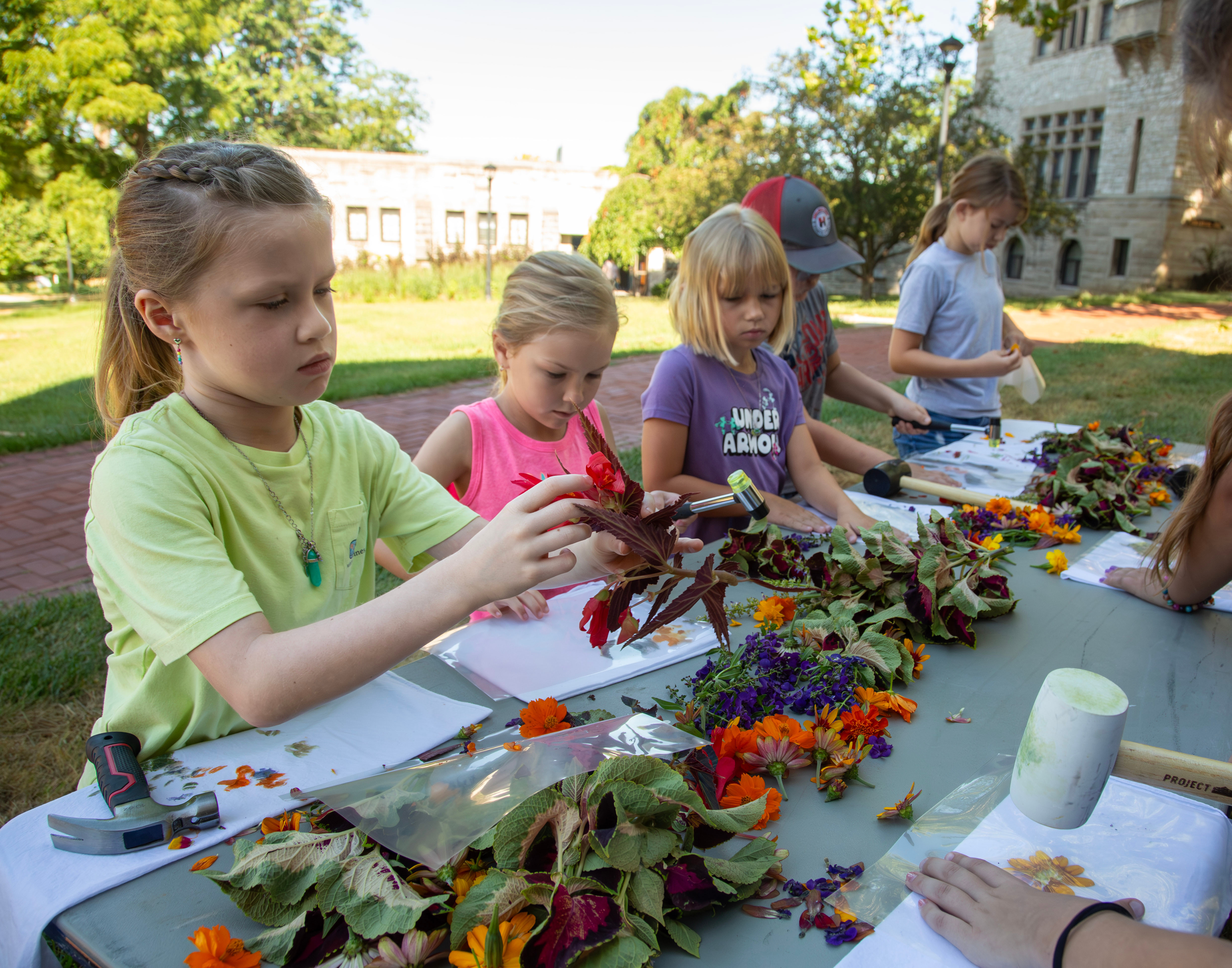 College for Kids students work on a craft in the Creative Gardening class. Photo by JAN DONA/L&C MARKETING & PR