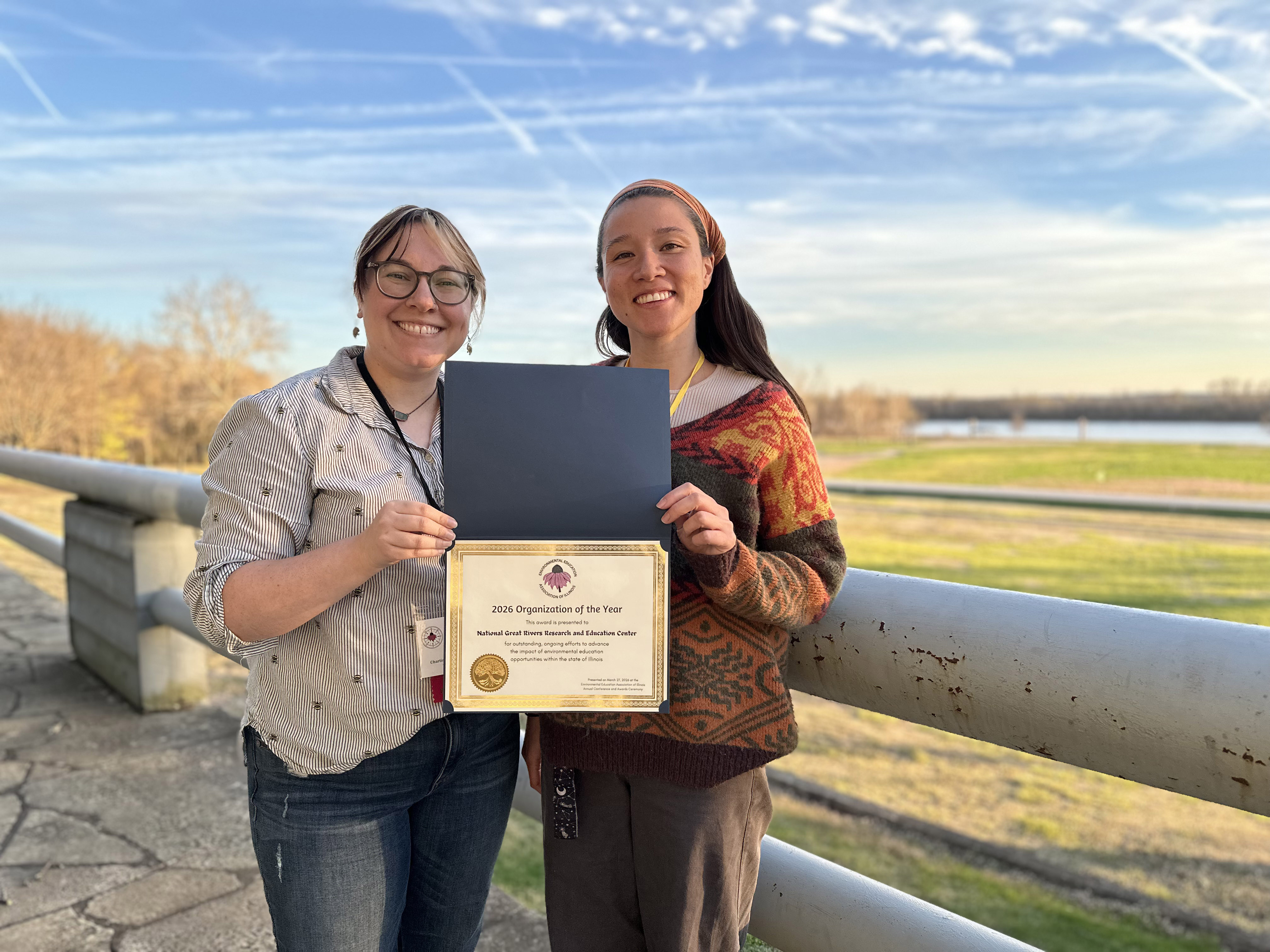 Director of Environmental Education Jessica Mohlman and Swarovski Waterschool USA Program Manager Jolena Pang pose with the NGRREC Education Team’s 2026 Organization of the Year Award from the Environmental Education Association of Illinois. 
