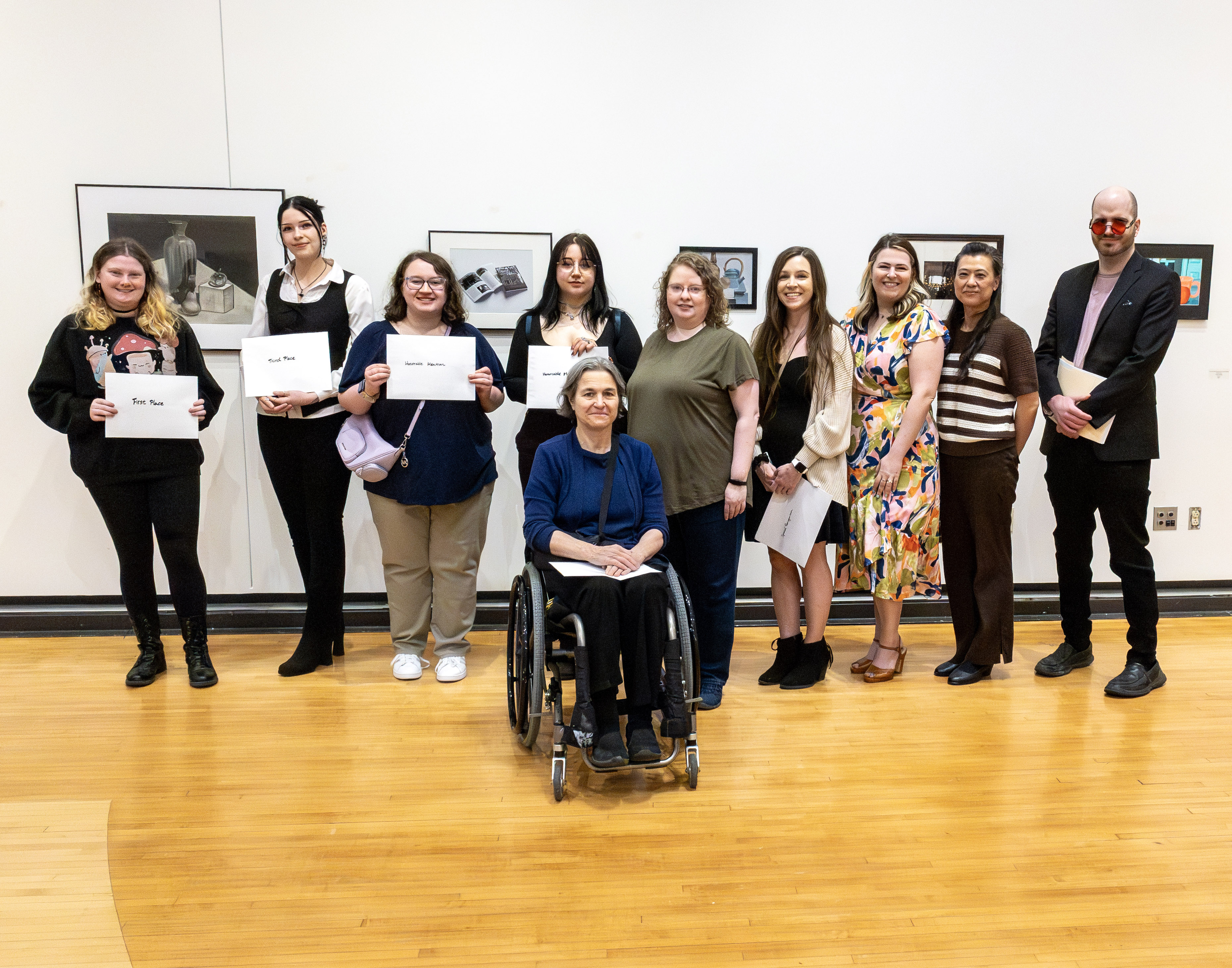 Winners from this year’s exhibit are, from left to right, Gabrielle McQuay, Katelyn Ren Dennis, Madison Rae, Mackenzie Geary, Ann Davidson, Melissa Mulrean, Bobbi Tervasi, Computer Graphics and Web Design Instructor Jacklyn Meyer, Fine Art Program Coordinator Angela Hung and Assistant Professor Jordan Walker. 