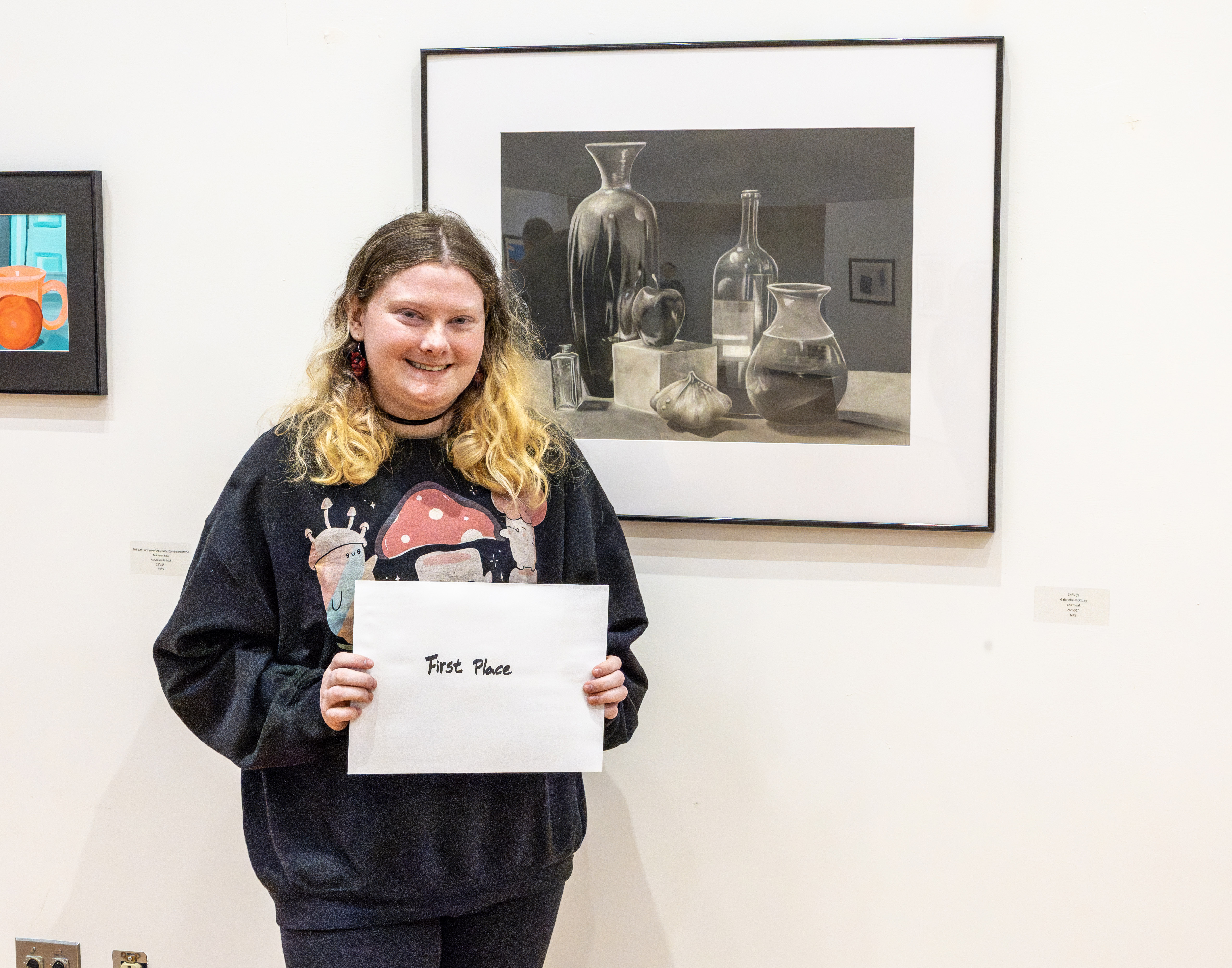 Gabrielle McQuay won first place with her charcoal drawing entitled “Still Life.”