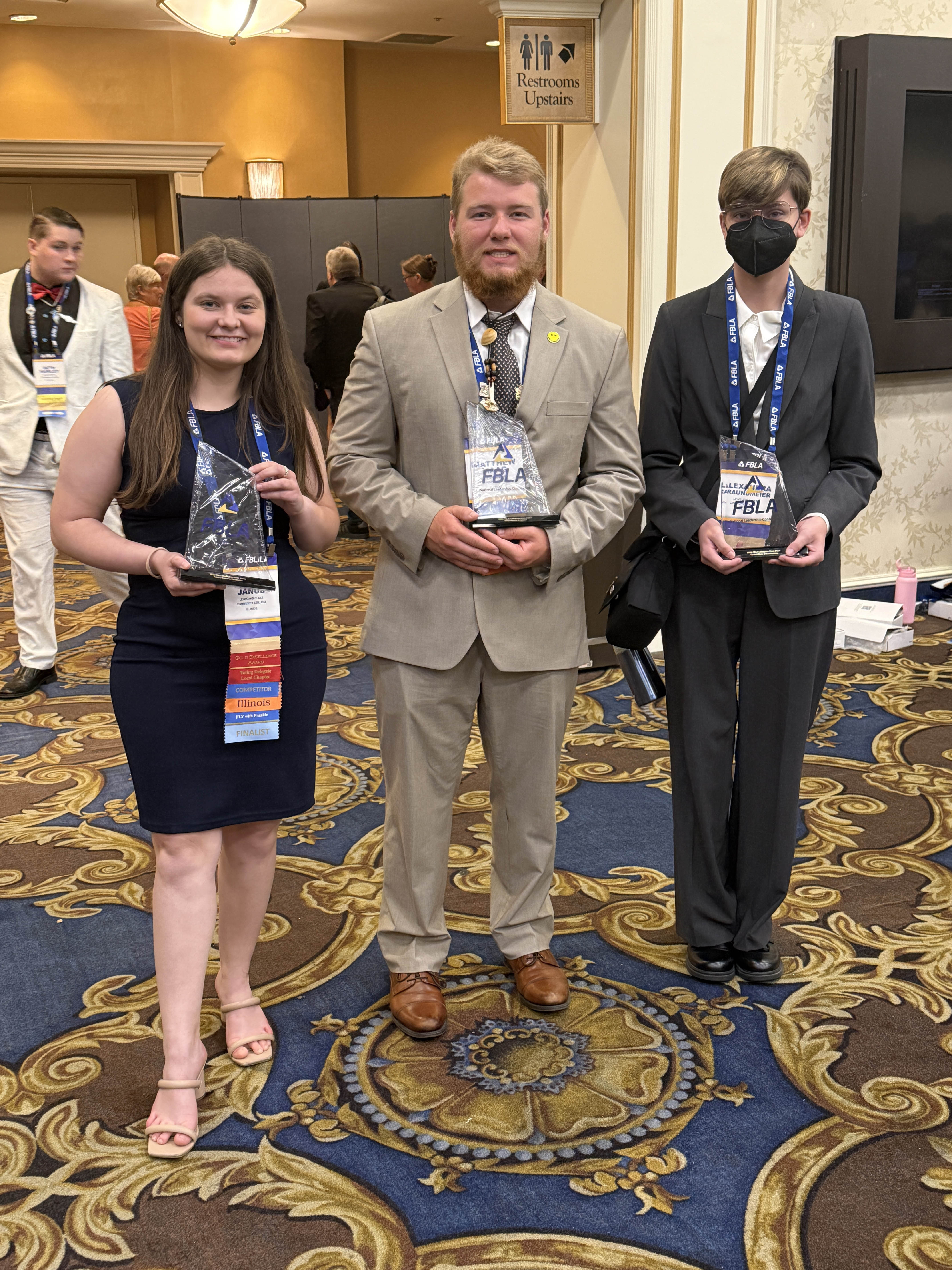 Julia Janus, Matthew Maag and Xander Braundmeir pose with their awards from the competition. Photo by Christina Wickenhauser, LC FBLA Advisor & Associate Professor, Accounting