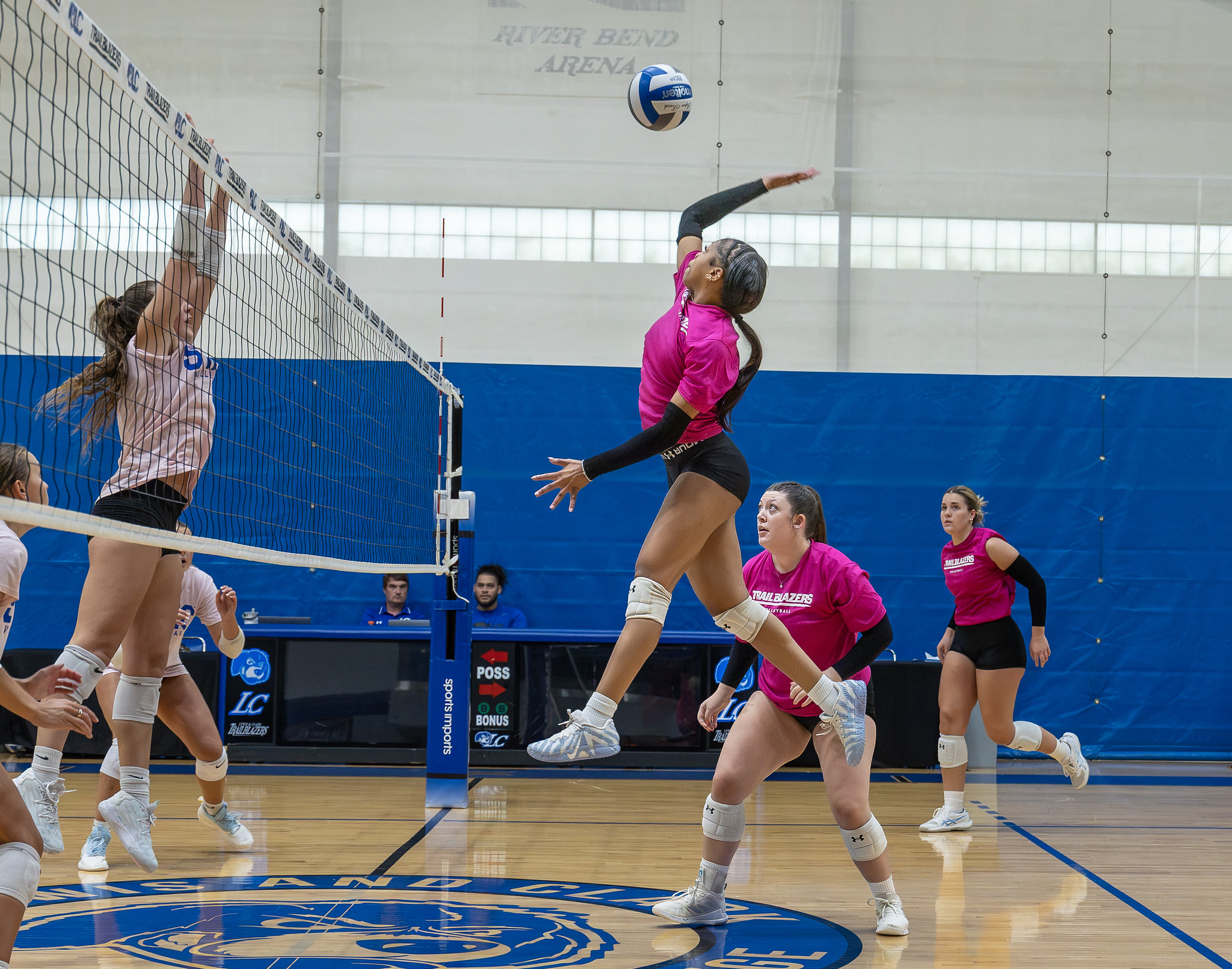 Anaiah Clanton-El goes up for a kill with backup from Berlynn Clayton (center) and Haili Pajares during a recent exhibition match against rival SWIC. Photo by Jan Dona, LC Marketing/PR.