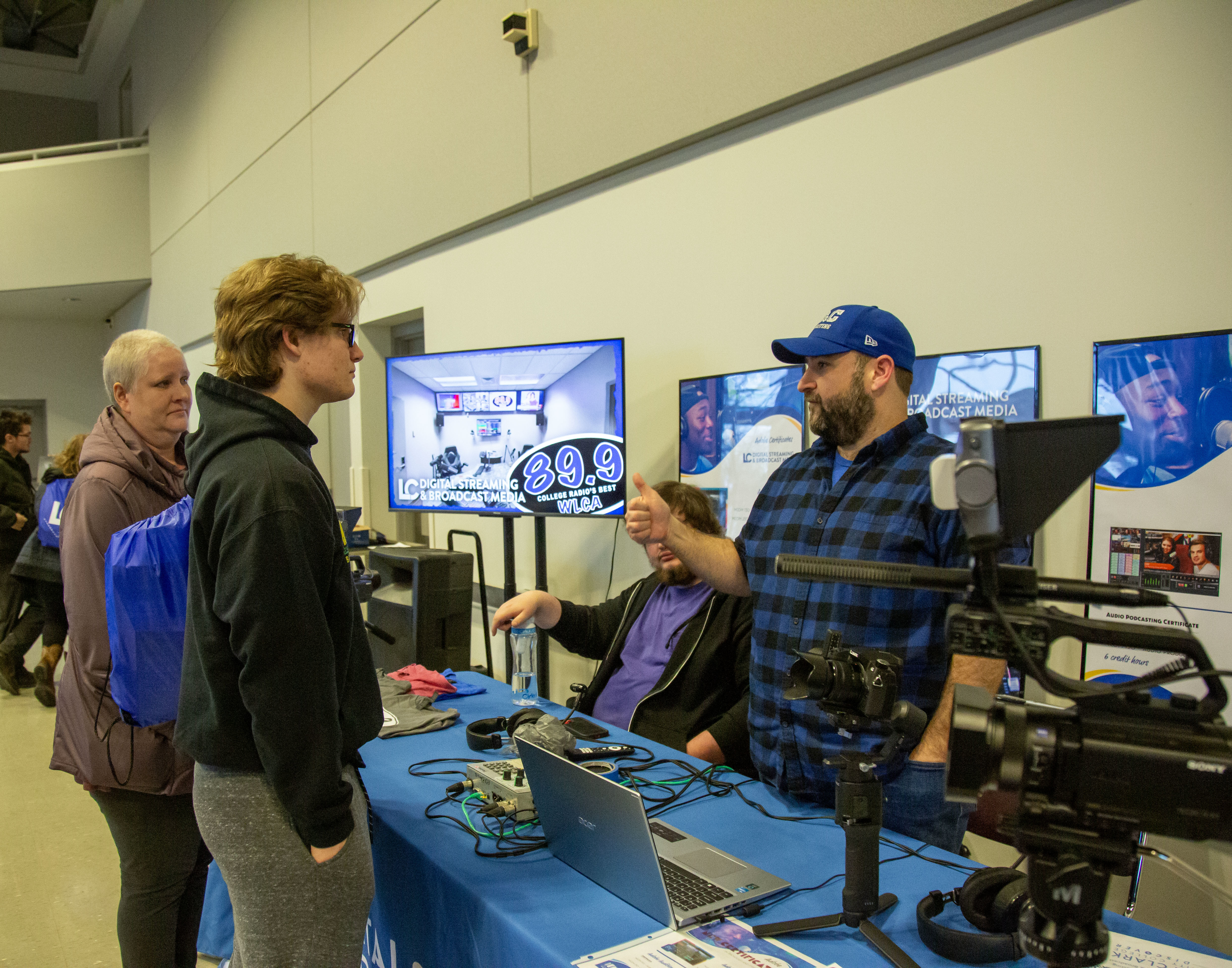 David Ollenbittle, WLCA Station Engineer and Digital Streaming and Broadcast Media Instructor speaks with guests during a Discover Day open house event. 